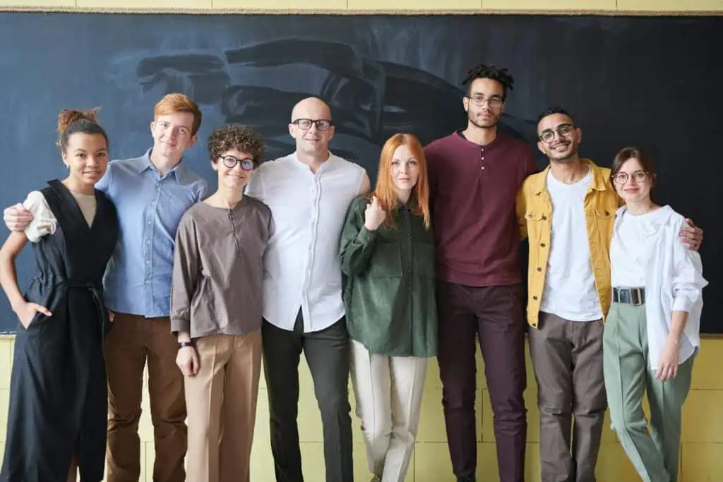 Photo Of People Standing Near Blackboard