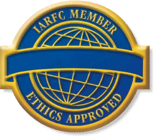 Circular badge displaying a blue globe with gold outline. Text reads "IARFC Member" and "Ethics Approved." A blank blue banner crosses the center.