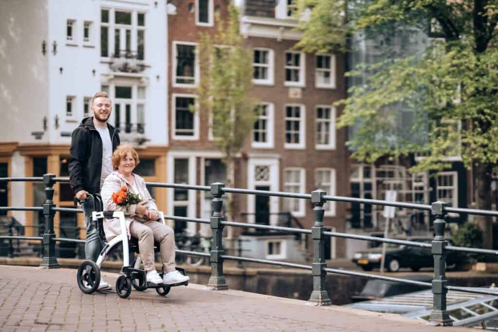 a man standing next to a woman on a scooter