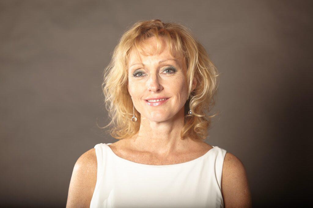 smile, happiness, joy, joyful, happy, expression, face, portrait, close up, art, art work, blonde woman, older woman, woman, lady, femininity, fashion, jewelry, earrings, business woman, confidence, style, hairstyle, smiling, female, older woman, older woman, older woman, older woman, older woman